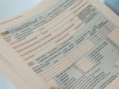 Detailed close-up image of a U.S. 1040 Individual Income Tax Return form, ideal for finance-related content.